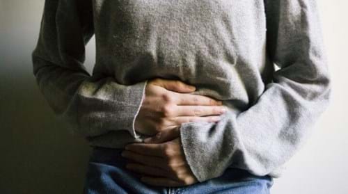 Photo of someone holding their stomach